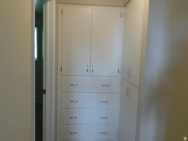 2148 Carolyn Way Bountiful, UT 84010 - Photo 17 of 40 Built-in cabinetry featuring white finishes and chrome hardware