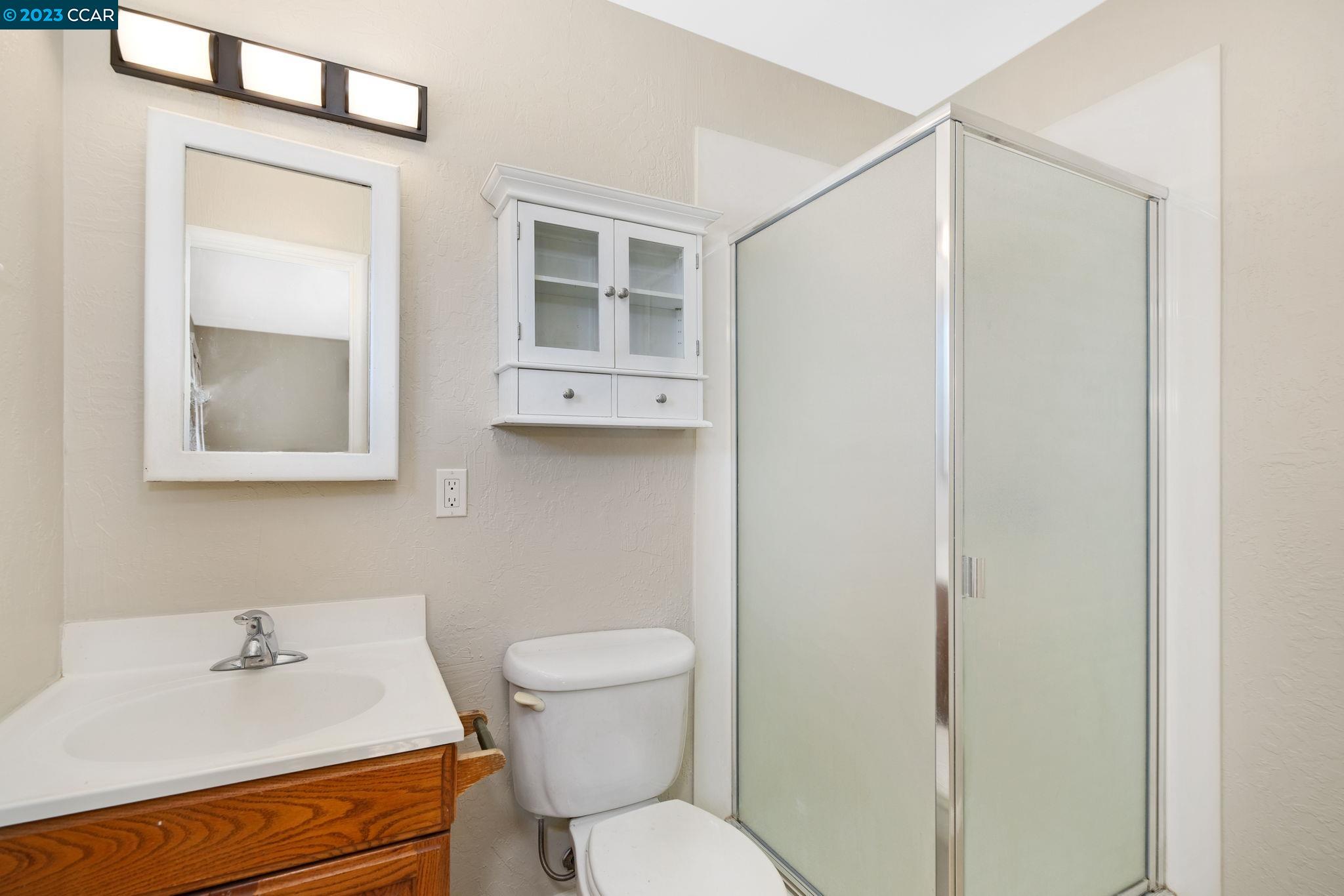 4266 Carter Court Concord, CA 94521 - Photo 17 of 26 a bathroom with a sink toilet and vanity