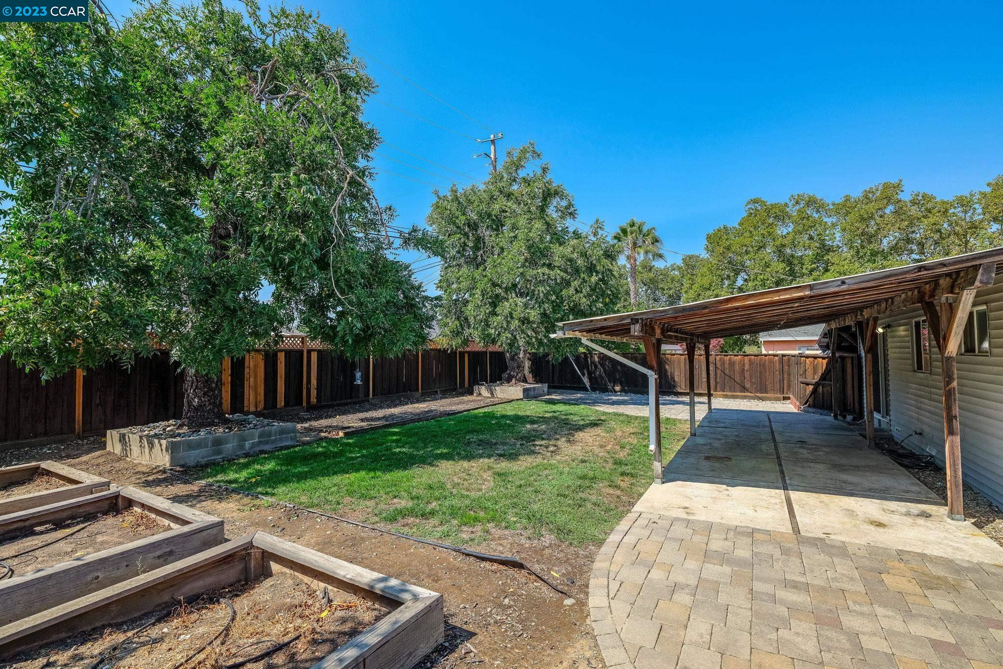 4266 Carter Court Concord, CA 94521 - Photo 24 of 26 a view of a backyard with a small cabin