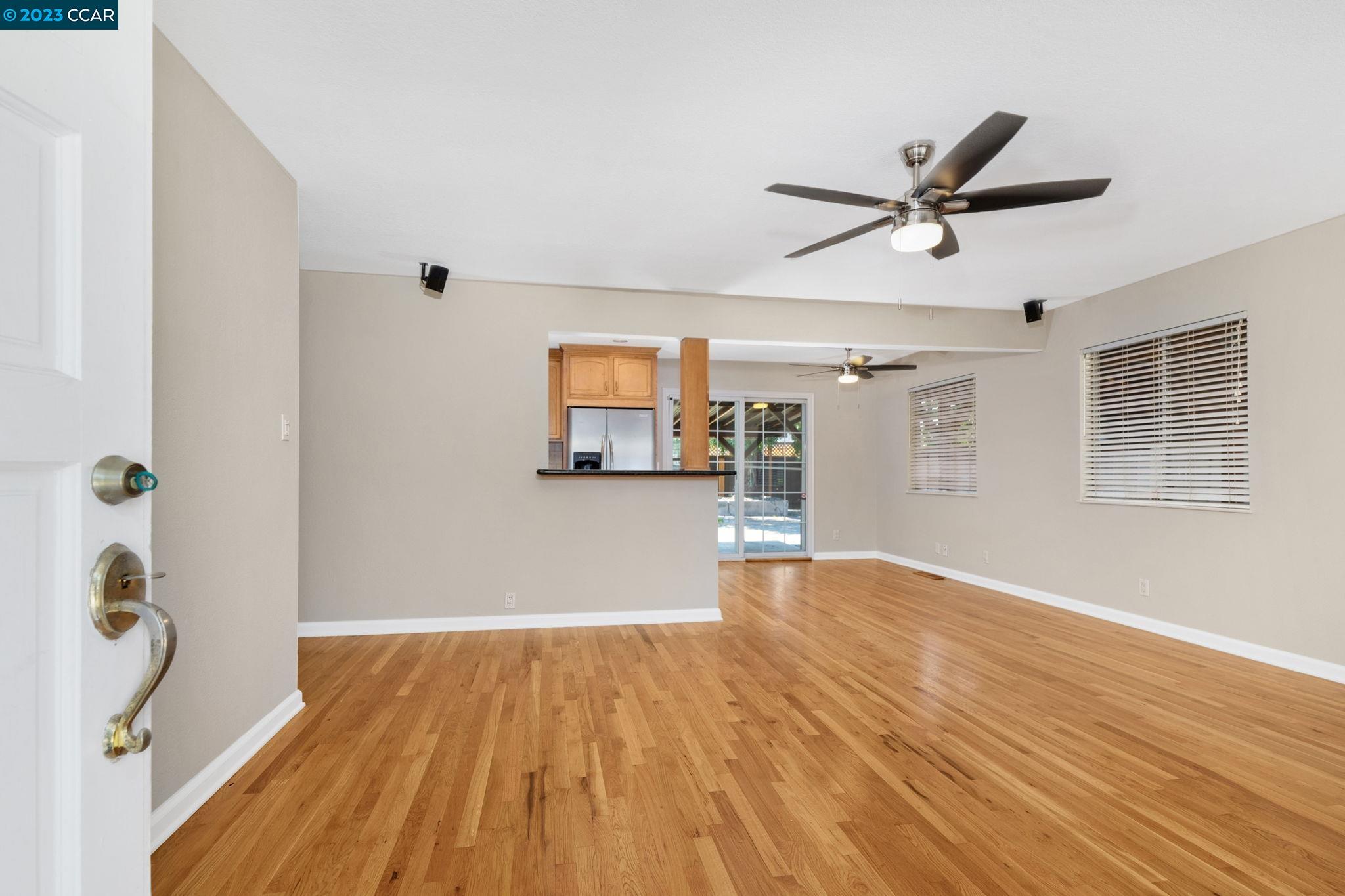 4266 Carter Court Concord, CA 94521 - Photo 4 of 26 a view of empty room with wooden floor and fan