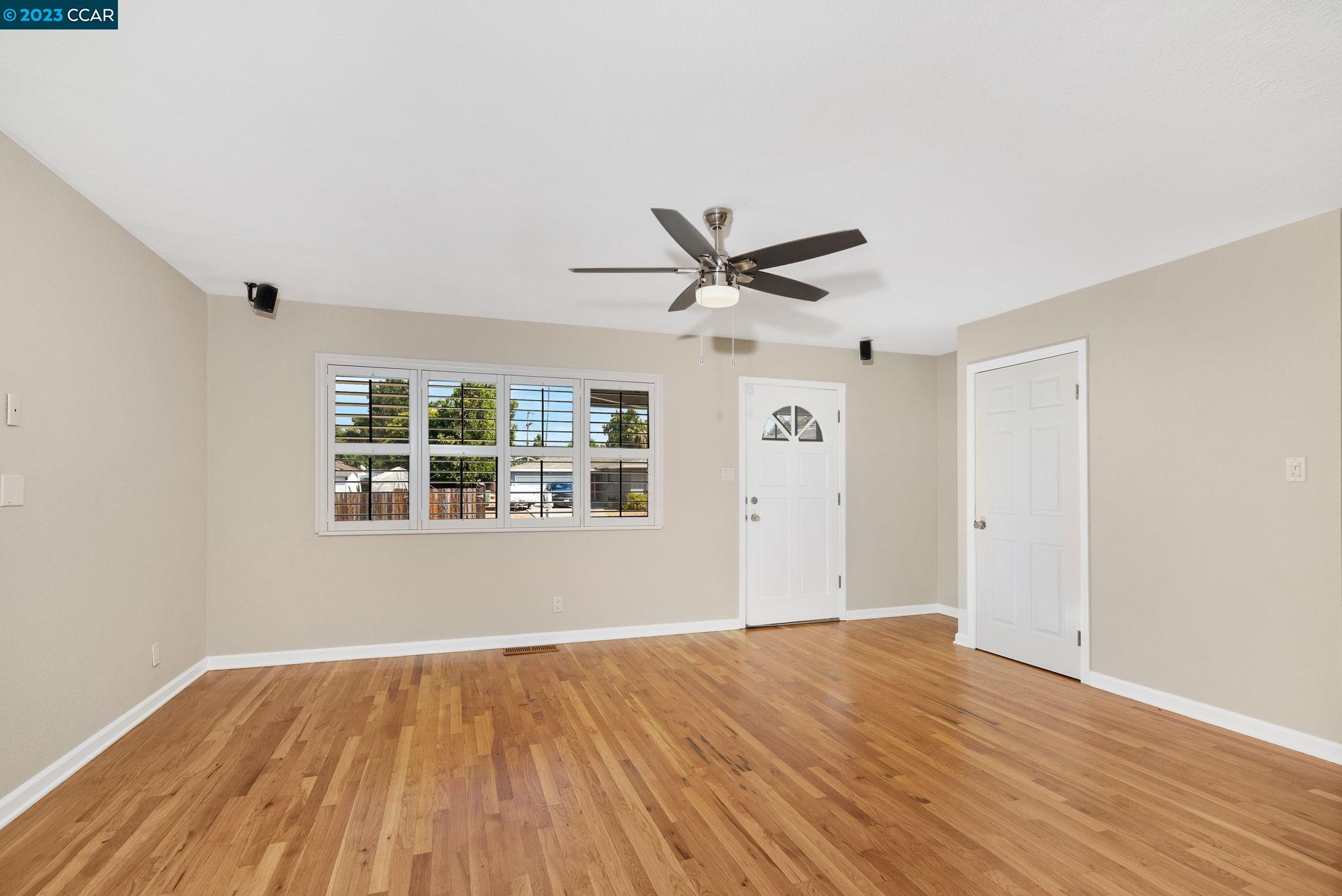 4266 Carter Court Concord, CA 94521 - Photo 5 of 26 a view of a big room with wooden floor and windows