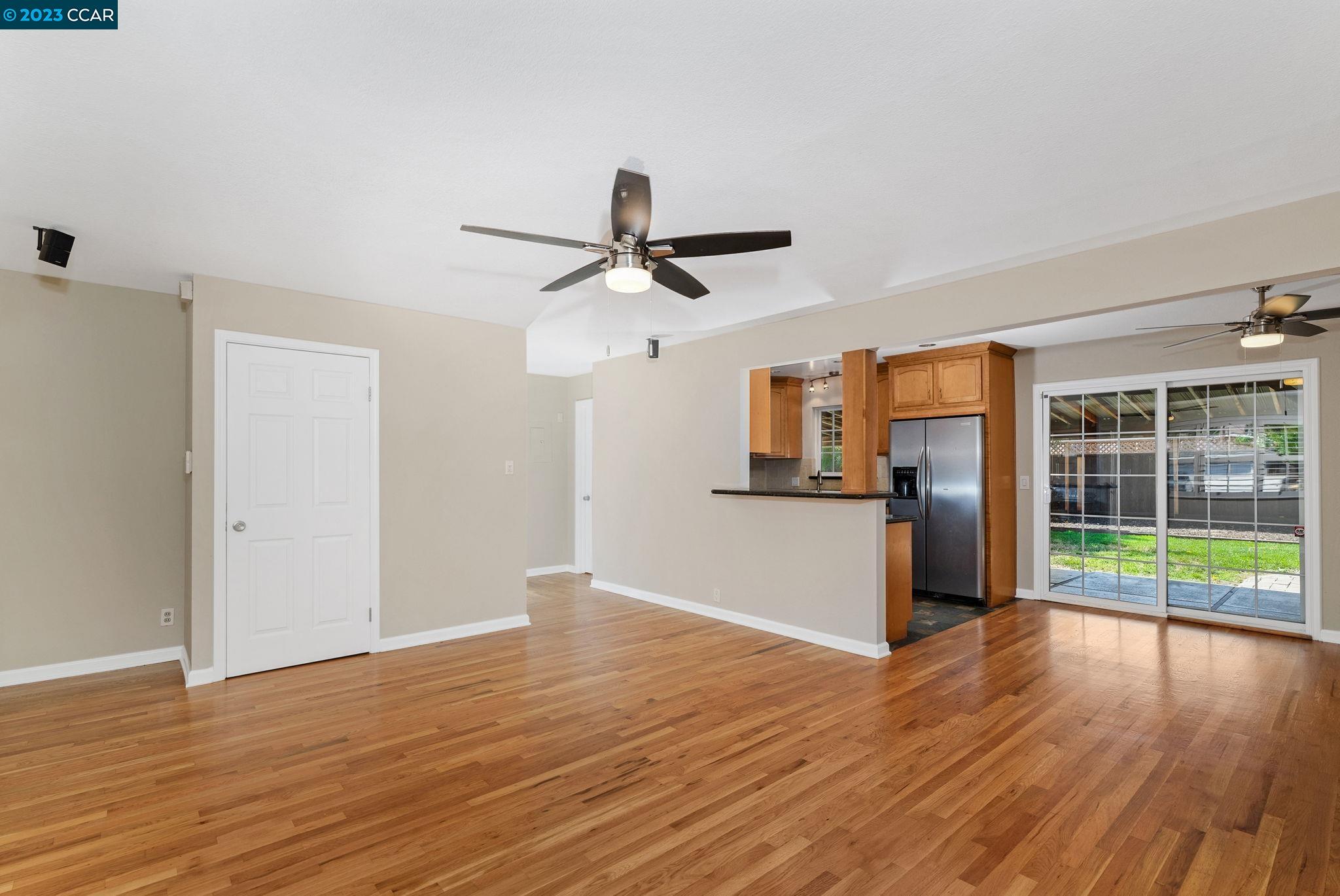 4266 Carter Court Concord, CA 94521 - Photo 8 of 26 a view of empty room with wooden floor and ceiling fan