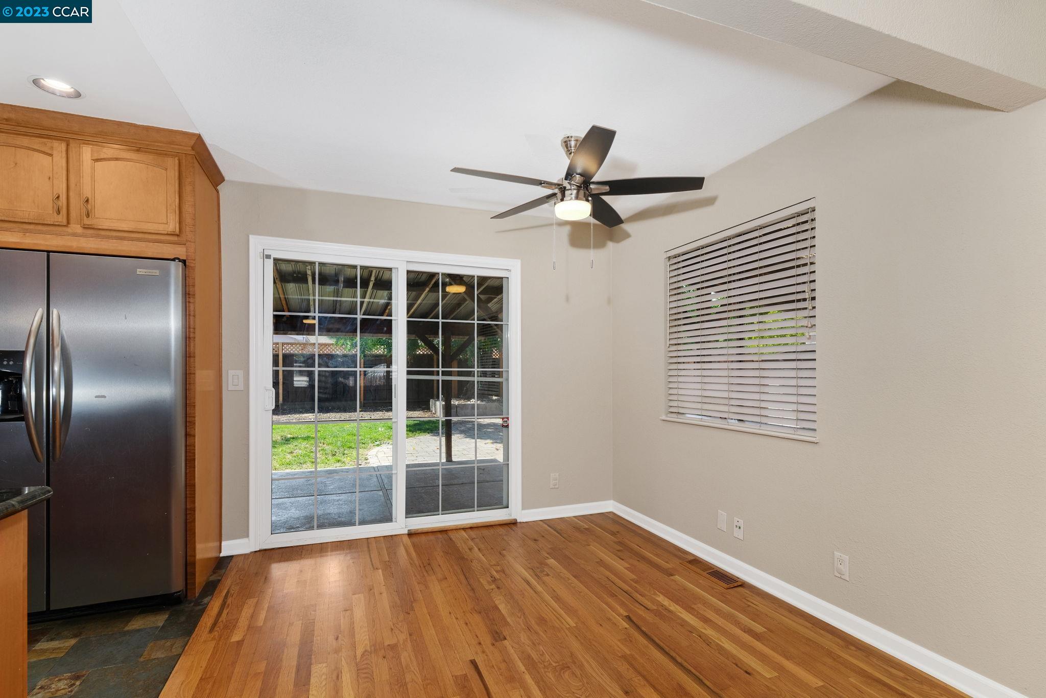 4266 Carter Court Concord, CA 94521 - Photo 9 of 26 a view of empty room with wooden floor and fan