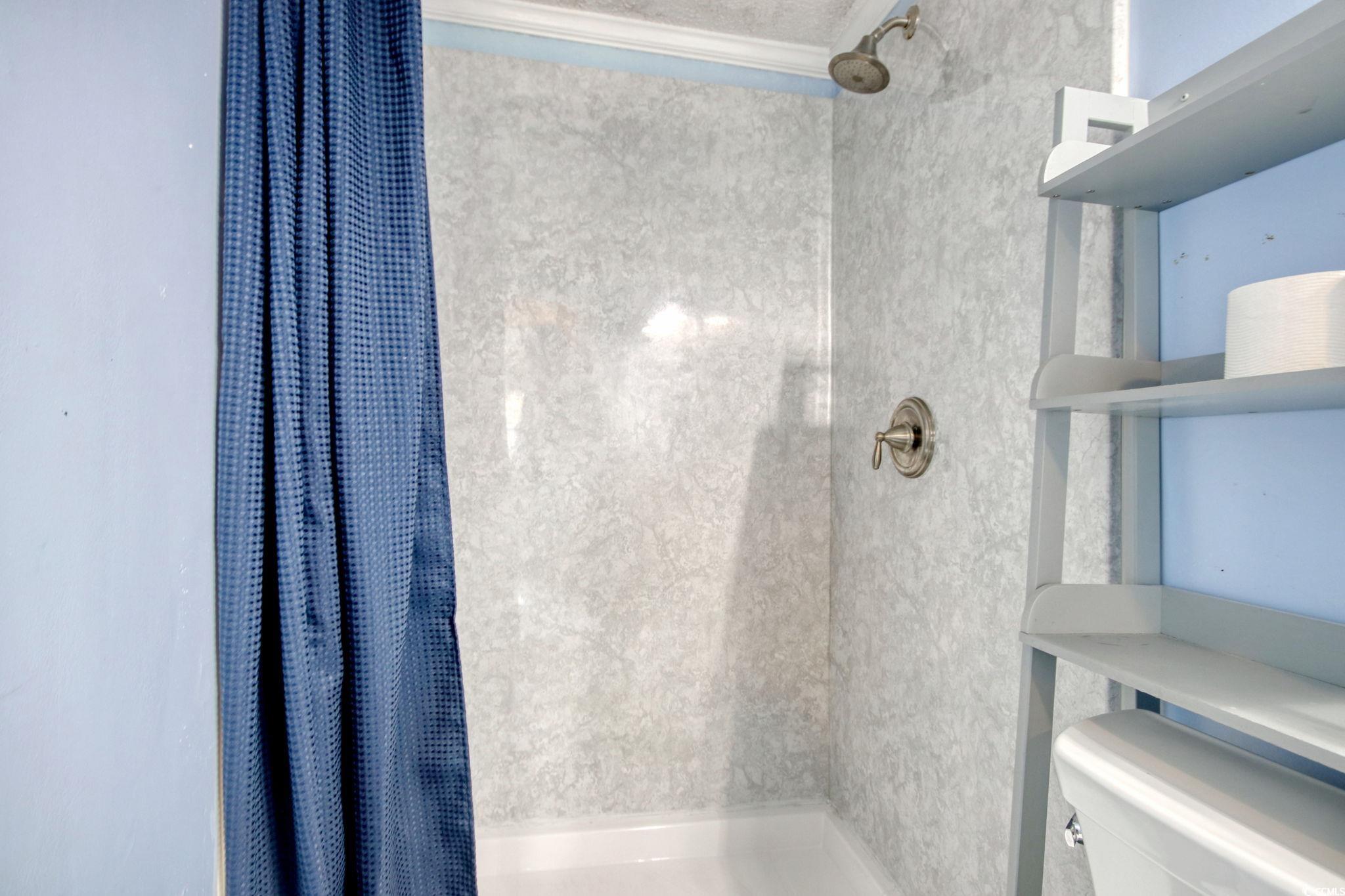 714 3rd Avenue South Surfside Beach, SC 29575 - Photo 20 of 30 Full bath featuring a shower stall and toilet
