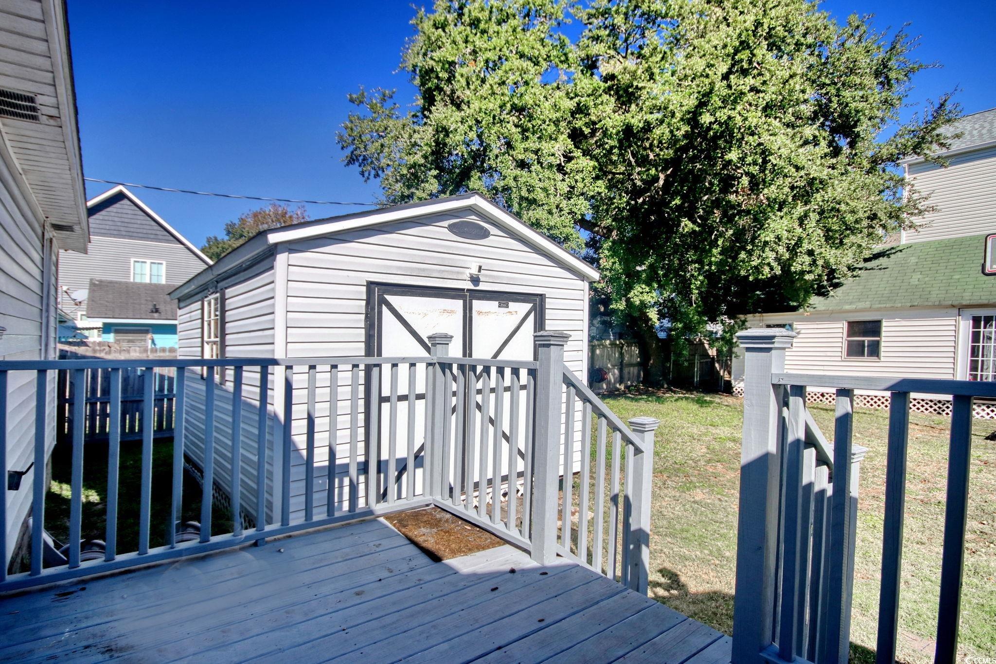 714 3rd Avenue South Surfside Beach, SC 29575 - Photo 21 of 30 Wooden deck with a storage unit
