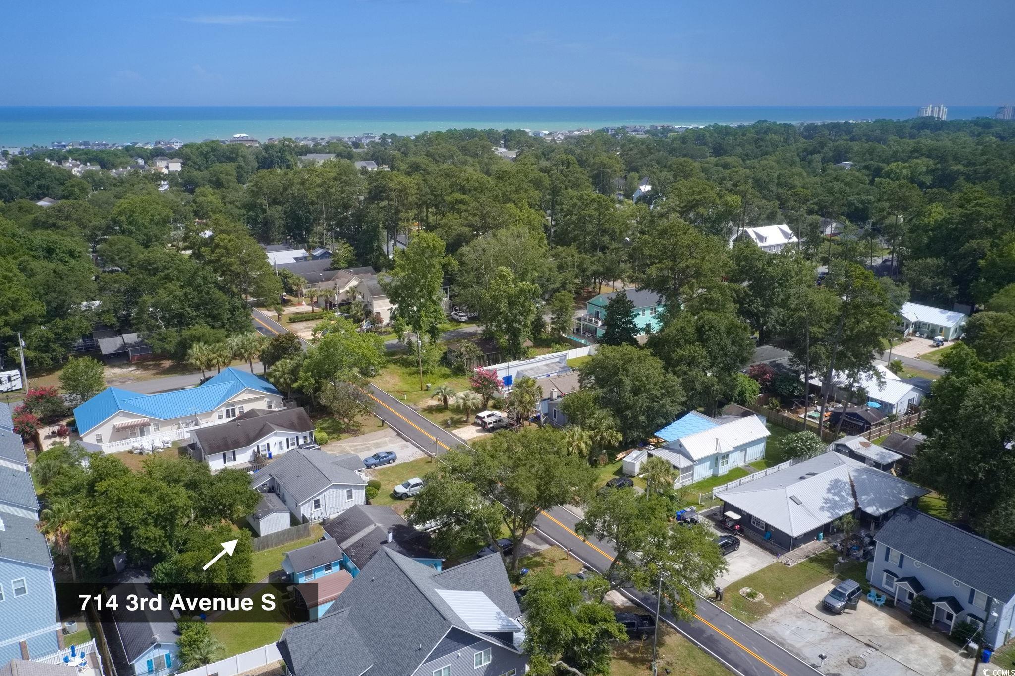 714 3rd Avenue South Surfside Beach, SC 29575 - Photo 28 of 30 Aerial view of residential area with a large body of water