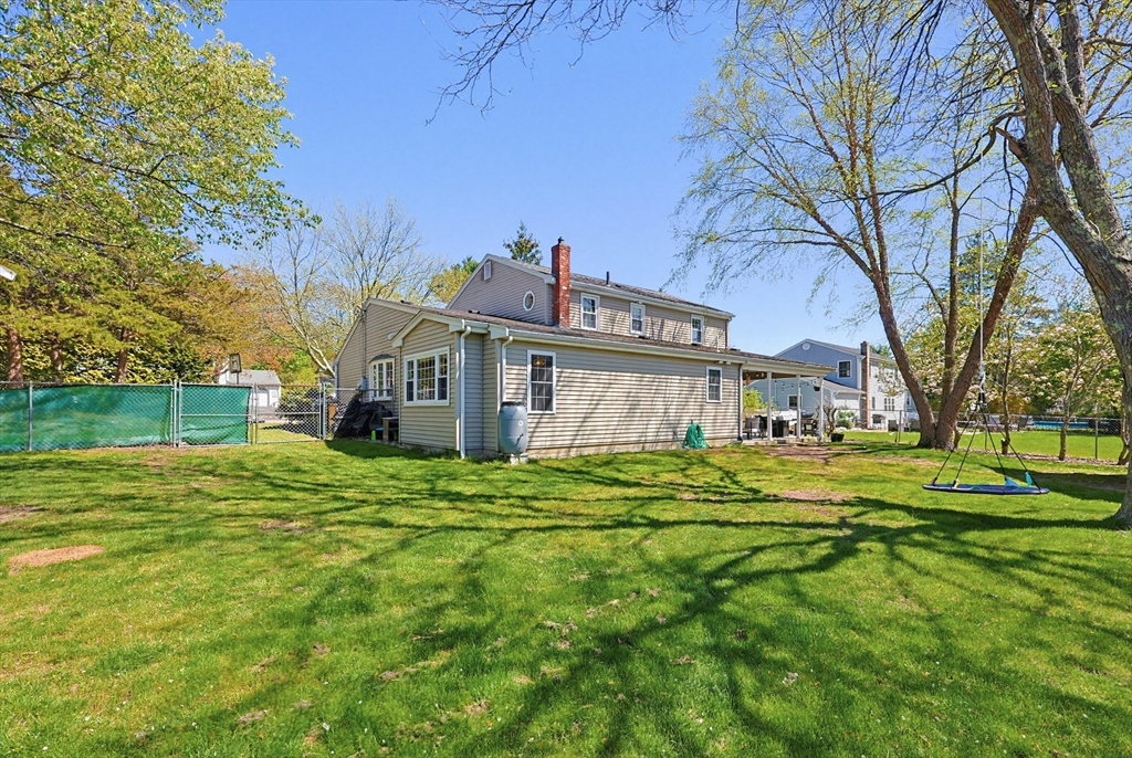 18 Anchorage Road Franklin, MA 02038 - Photo 40 of 42 a front view of a house with a garden