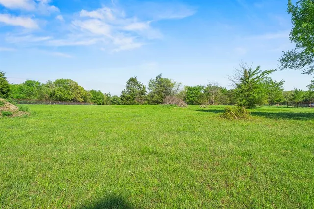 a view of a city with lush green forest