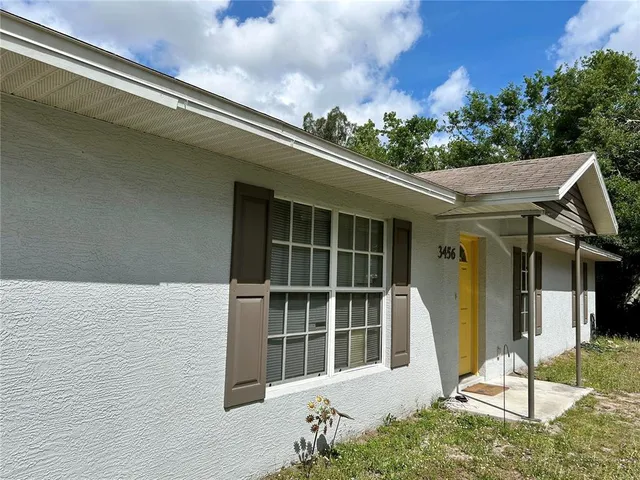 a front view of a house with a porch