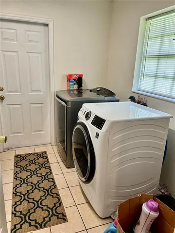 a utility room with dryer and washer