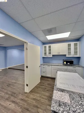 a view of cabinets with wooden floor