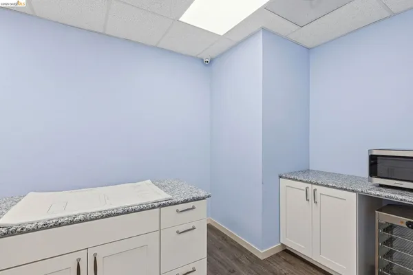 a kitchen with a sink dishwasher and cabinets