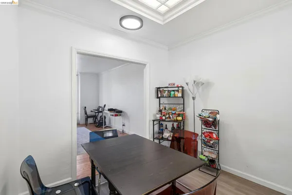 a kitchen with granite countertop a sink a stove and cabinets
