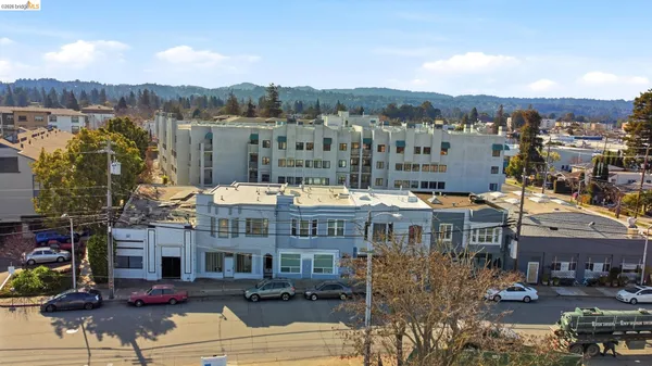 a view of large building with a city street