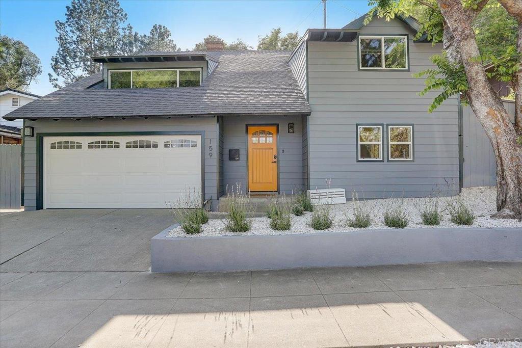 a view of a house with a couch and potted plant