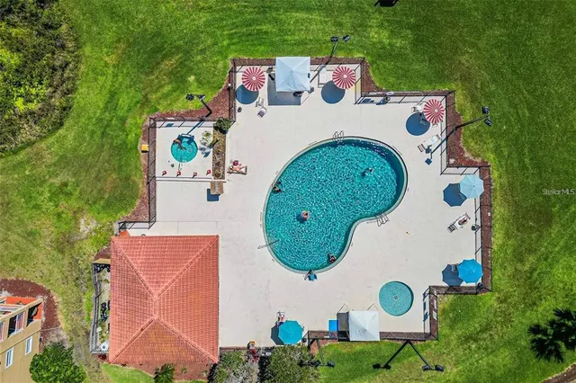 an aerial view of a house with garden space and street view