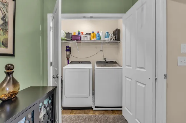a bathroom with a double vanity sink toilet and a mirror