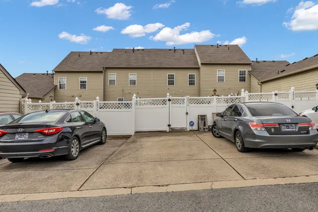 a view of a house with backyard and a garden