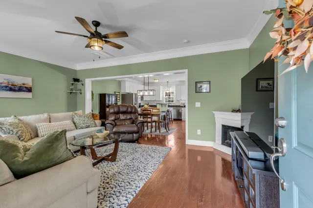 a kitchen with stainless steel appliances granite countertop a sink a stove a refrigerator and cabinets