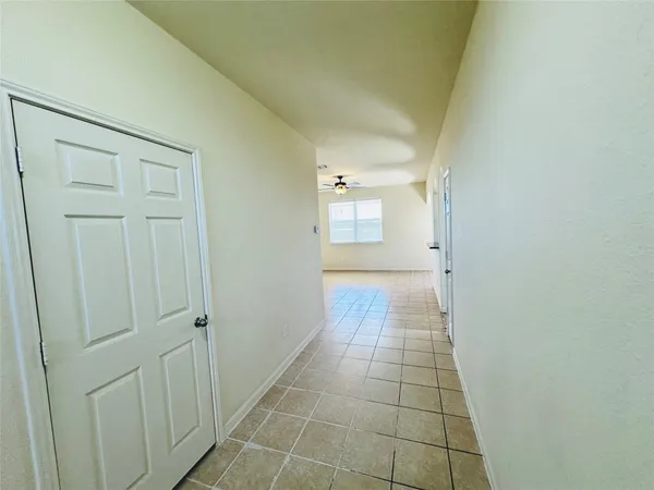a kitchen with stainless steel appliances granite countertop a refrigerator a stove and a sink
