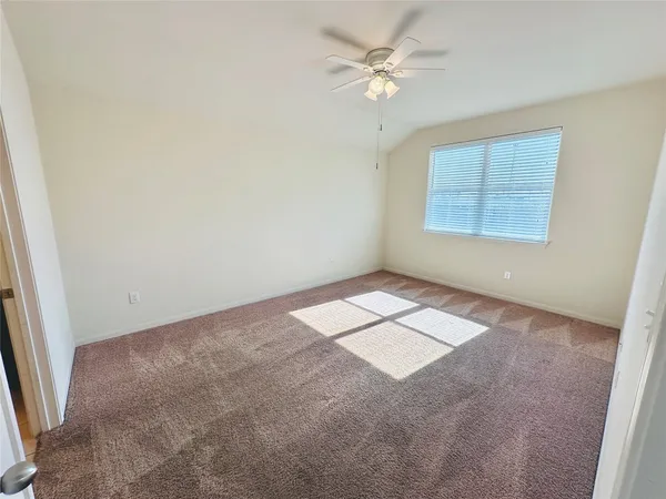 a view of a big room with carpet
