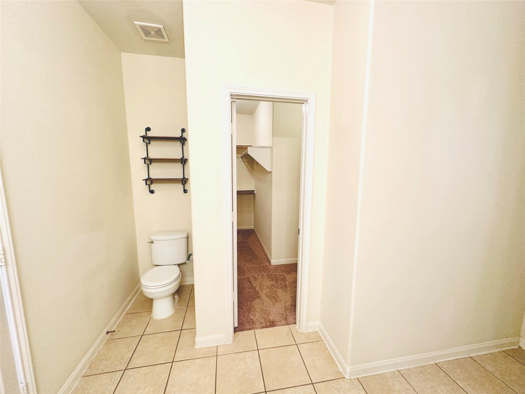 19309 W.T. Gallaway Street Manor, TX 78653 - Photo 31 of 38 a bathroom with a toilet