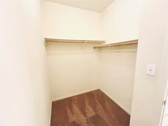 a view of a house with backyard and porch