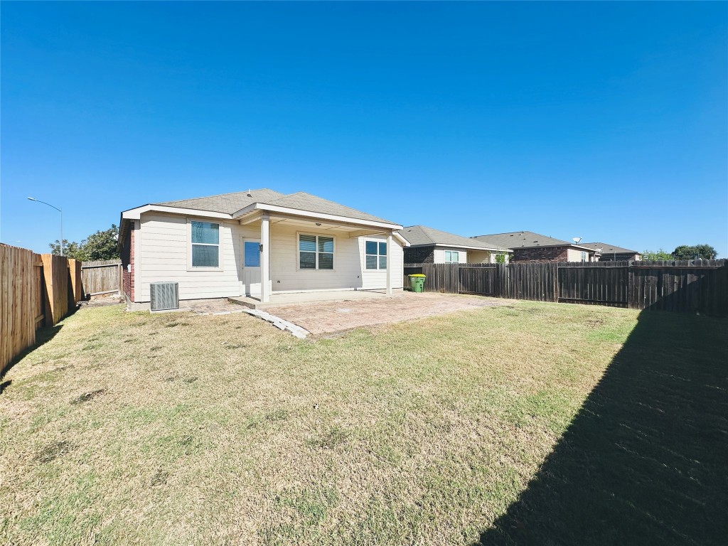 19309 W.T. Gallaway Street Manor, TX 78653 - Photo 36 of 38 a house view with a backyard space