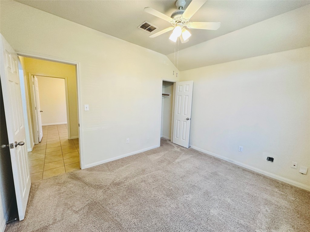 19309 W.T. Gallaway Street Manor, TX 78653 - Photo 5 of 38 an empty room with a ceiling fan and a window