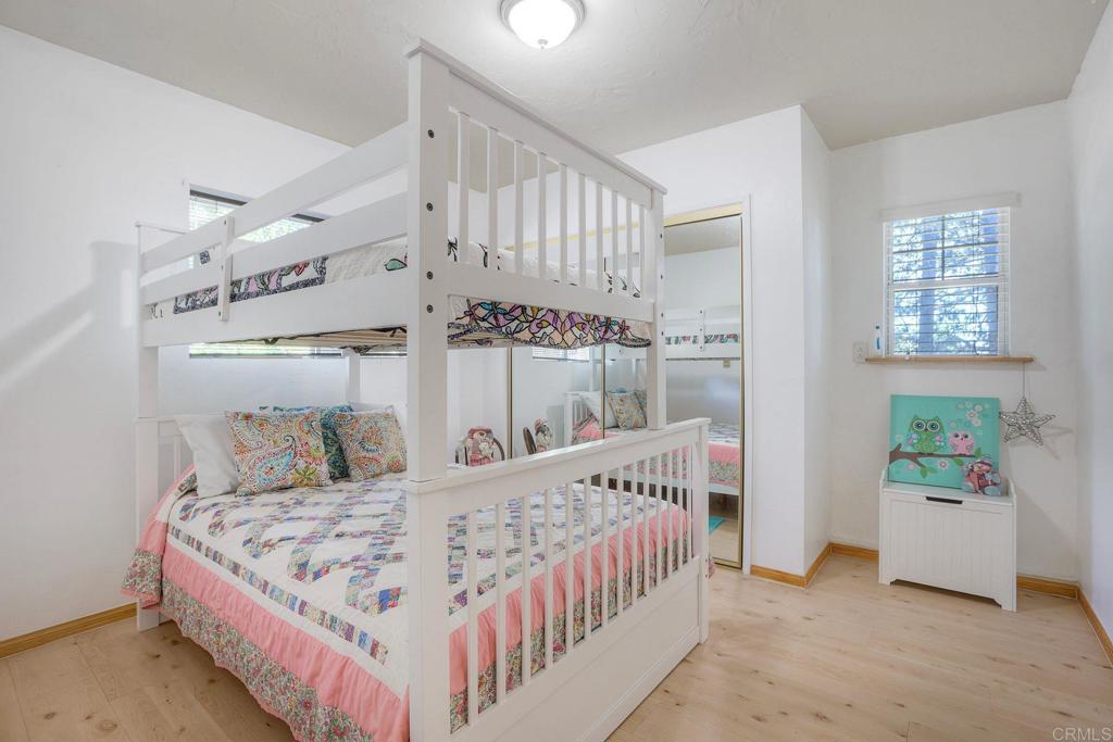 22223 Crestline Road Palomar Mountain, CA 92060 - Photo 45 of 90 a bedroom with a bed and a large window