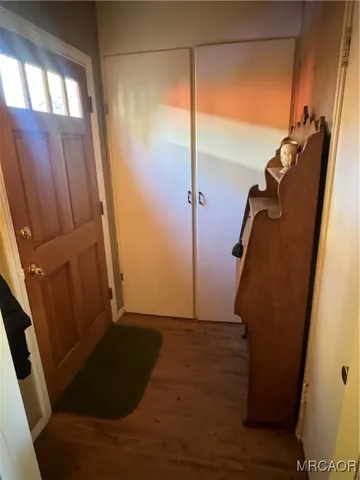 a view of walk in closet with clothes