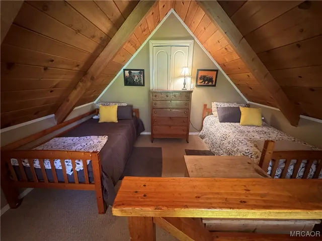 a view of living room kitchen and entryway