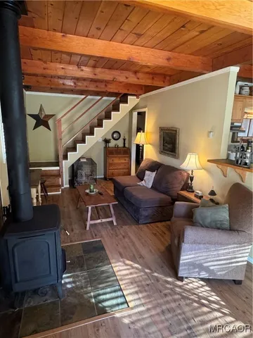 a living room with furniture and a rug
