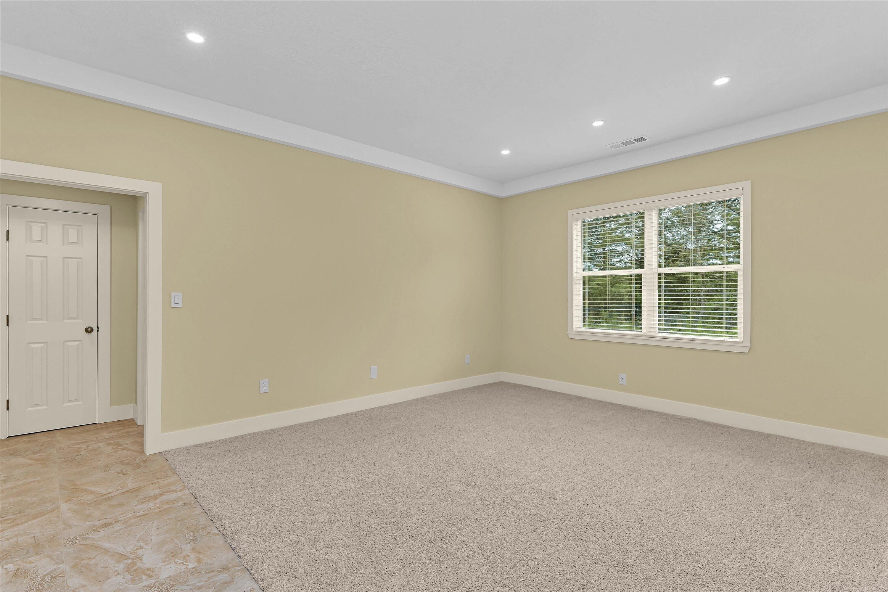 4625 Old Waynesboro Road Hephzibah, GA 30815 - Photo 22 of 34 Primary Bedroom with new carpet and tile floors. Measures 18 x 19 sf