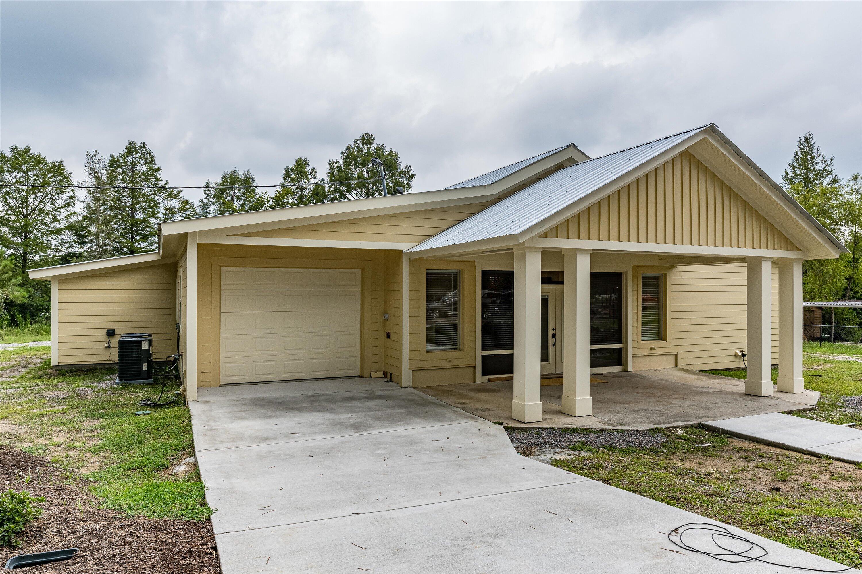 4625 Old Waynesboro Road Hephzibah, GA 30815 - Photo 4 of 34 Single car garage with built in shelves and lots of room for storage