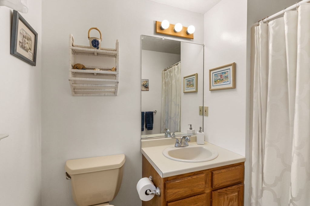 37 Ansel Howland Road Barnstable, MA 02632 - Photo 11 of 26 a bathroom with a toilet sink and mirror