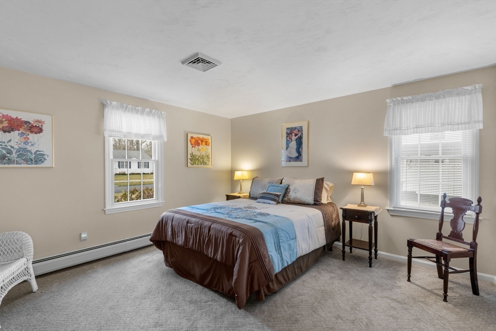 37 Ansel Howland Road Barnstable, MA 02632 - Photo 12 of 26 a bedroom with a bed chairs and window