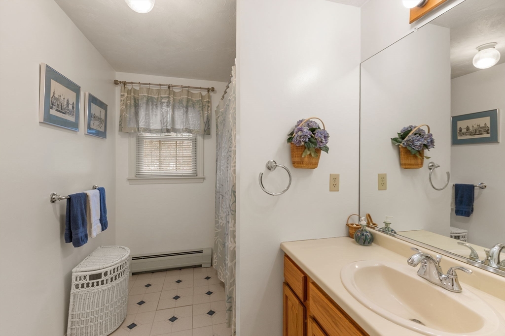 37 Ansel Howland Road Barnstable, MA 02632 - Photo 14 of 26 a bathroom with a sink a toilet and a mirror