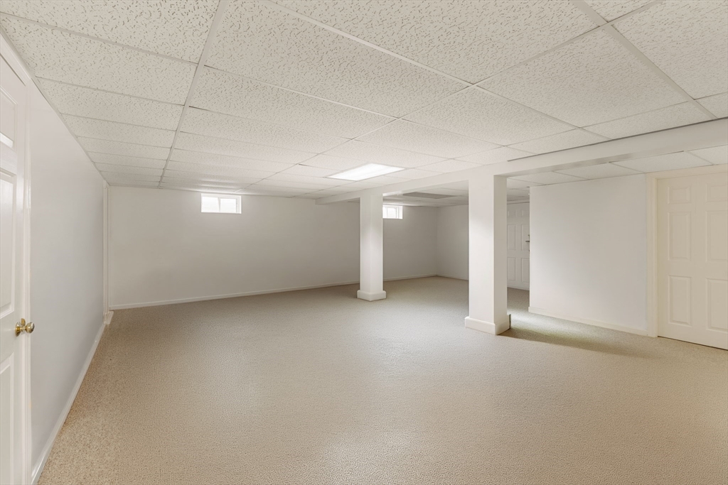 37 Ansel Howland Road Barnstable, MA 02632 - Photo 18 of 26 an empty room with a empty space and windows