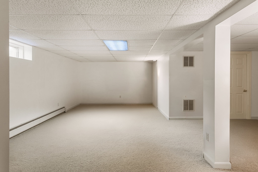 37 Ansel Howland Road Barnstable, MA 02632 - Photo 20 of 26 an empty room with a empty space and windows