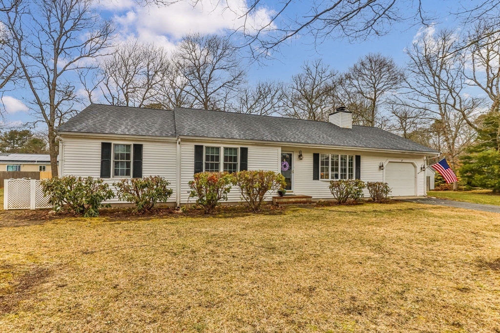 37 Ansel Howland Road Barnstable, MA 02632 - Photo 3 of 26 a front view of a house with a garden and yard