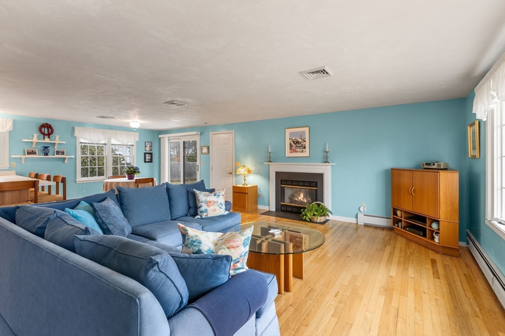 37 Ansel Howland Road Barnstable, MA 02632 - Photo 6 of 26 a living room with furniture and a fireplace