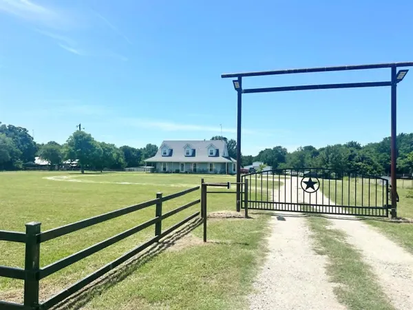 a view of a back yard from a balcony