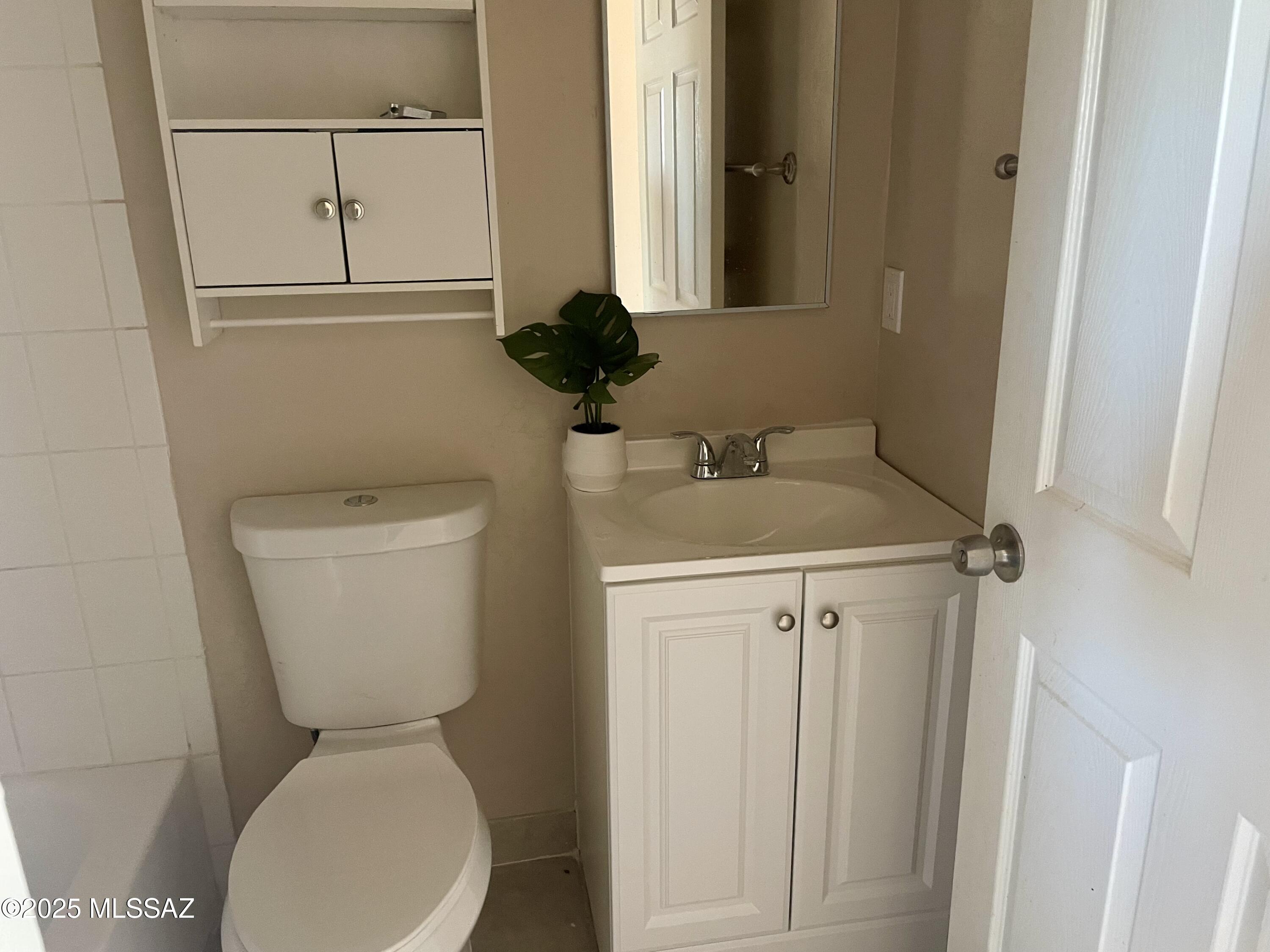 1503 Camino Bacalao Rio Rico, AZ 85648 - Photo 39 of 43 a white toilet sitting next to a bathroom sink