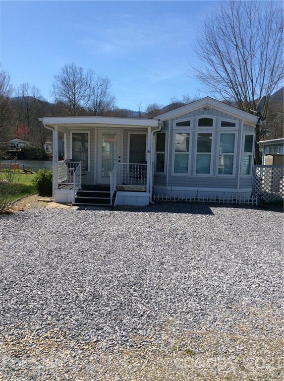 306 Mallard Loop Waynesville, NC 28785 - Photo 1 of 19 front view of a house with a yard