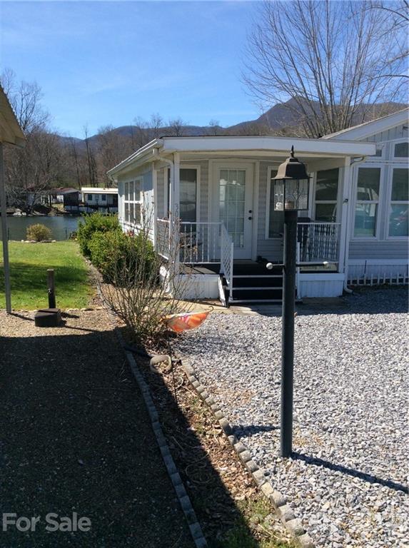 306 Mallard Loop Waynesville, NC 28785 - Photo 2 of 19 a front view of a house with a yard