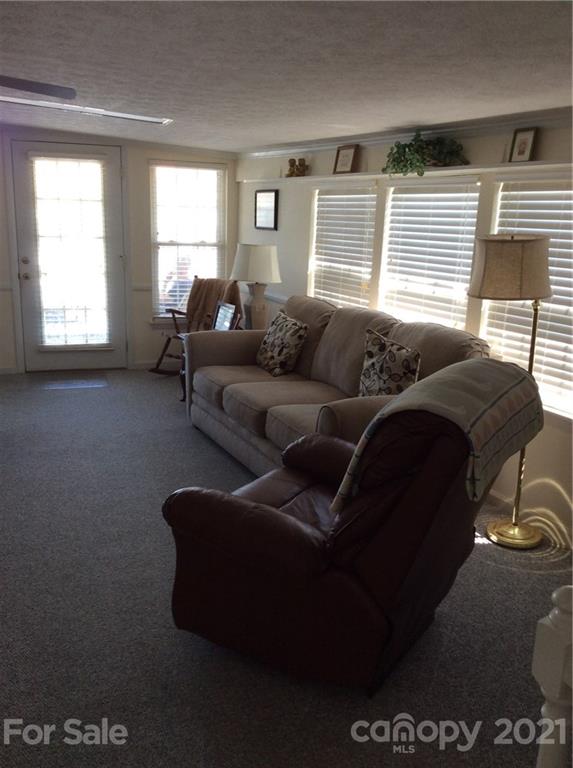 306 Mallard Loop Waynesville, NC 28785 - Photo 7 of 19 a living room with furniture and a window