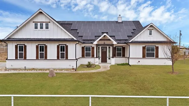 a front view of a house with swimming pool