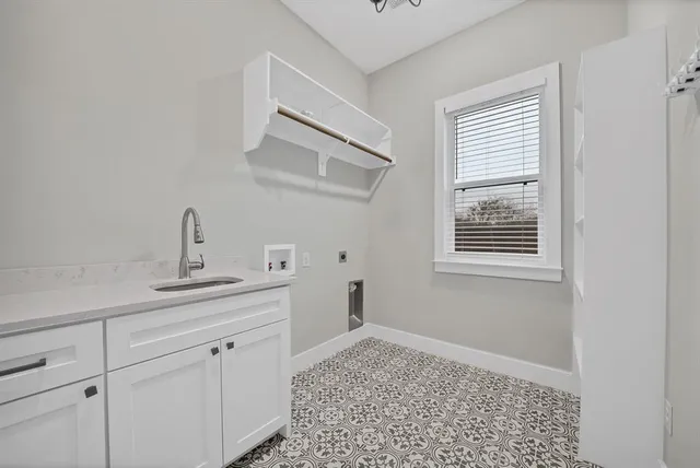 a kitchen with a sink and cabinets