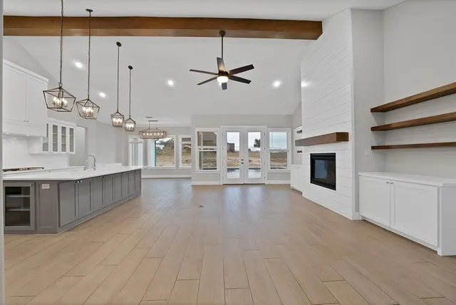 a view of a kitchen with a sink and microwave